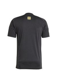 Black athletic t-shirt featuring short sleeves, a crew neckline, and a small yellow logo "NTS" at the back near the collar. Soft, stretchy fabric.