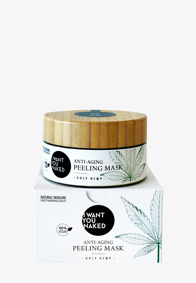 Contenant de masque peeling anti-âge avec couvercle en bambou et boîte, étiqueté "Je Te Veux Nu" et illustré d'une feuille de chanvre.