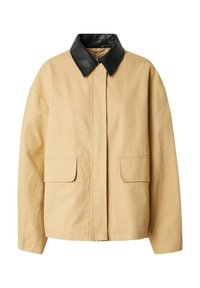 Beige Jacke mit einem schwarzen Lederkragen, ausgestattet mit einem Front-Reißverschluss und zwei großen aufgesetzten Taschen. Hergestellt aus einem robusten Baumwollstoff.