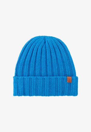 Blauwe gebreide beanie met een geribbelde textuur en opgerolde boord. Voorzien van een klein bruin merklabel aan de zijkant. Gemaakt van een zachte, rekbare stof.