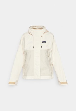 Helle beige Kapuzenjacke mit einem Frontreißverschluss, zwei seitlichen Taschen und kontrastierenden Stoffdetails an den Bündchen. Glatte, leicht strukturierte Oberfläche.