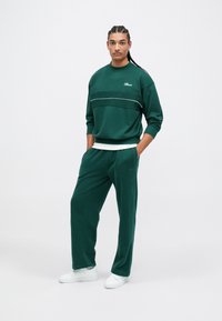 Ellesse PAULLO - Tepláky - dark green