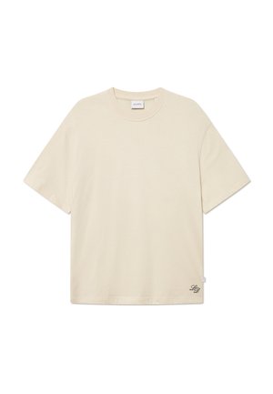 Cream-colored t-shirt made of cotton, featuring a round neckline, short sleeves, and a subtle logo detail embroidered on the bottom right.