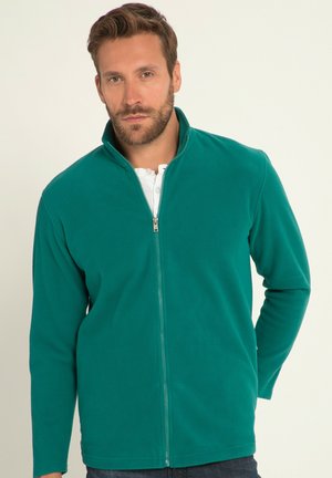 Giacca in pile teal con chiusura con zip e colletto alto. Presenta maniche lunghe e una texture liscia, adatta per il layering.