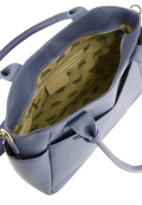 Light blue leather handbag with a textured finish. Includes a gold zipper, interior pocket, and beige lining featuring a logo pattern.