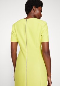 BOSS DAMAISA - Žerzejové šaty - medium yellow