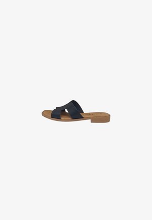 Sandalo piatto con suola color cuoio e ampie fasce di pelle nera che si incrociano sul piede, punta aperta e design con retro aperto.