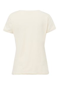Camiseta de manga corta color crema con cuello redondo y corte recto. Textura suave sin patrones o acentos visibles.