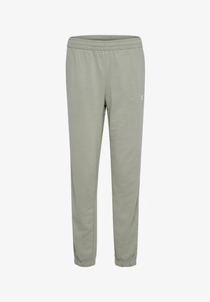 Pantaloni jogger grigi chiari con cintura e polsini elasticizzati, realizzati in materiale morbido. Presentano un branding minimale sul lato.