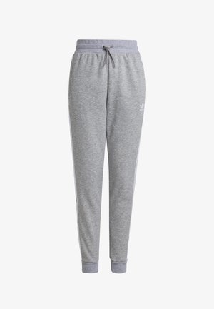 Pantalon de survêtement gris avec taille et poignets élastiques, cordon de serrage à l'avant et logo discret de la marque sur la partie supérieure de la cuisse.