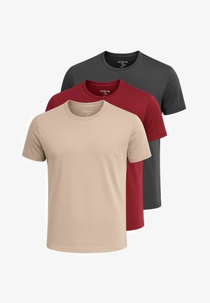 Kolme lyhythihaista t-paitaa: beige, burgundy ja tummanharmaa. Valmistettu puuvillasta, joissa on pyöreät kaula-aukot ja sileät pinnat.