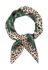 Silk scarf featuring a cream background with leopard print and intricate turquoise and orange paisley patterns, tied in a knot.
