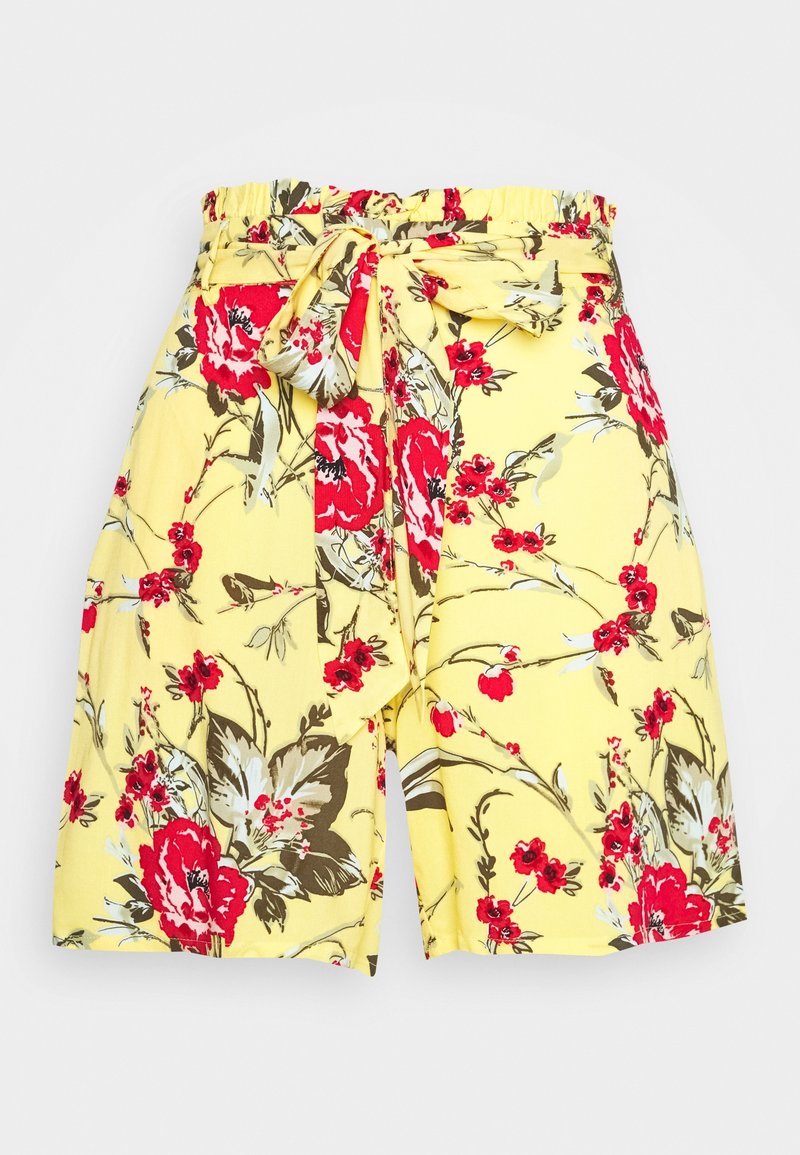 Shorts à fleurs en tissu jaune, ornés d'un motif floral rouge et vert, avec une taille élastique et un détail noué sur le devant.