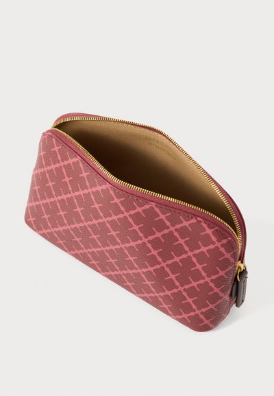 Tumedaroosa zipikorv pealiskihiga ning kuldse tõmblukuga. Sisemus helepruuni voodriga. Veidi kergelt kitsenev disain, tugev ehitus.