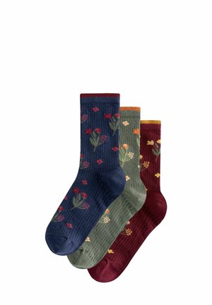 Pack of three socks in navy, green, and burgundy; ribbed texture with floral patterns in red, orange, and yellow on each sock.
