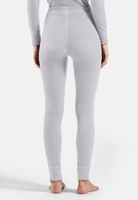 Light gray leggings with a fitted design, ribbed texture, and elastic waistband. The cuffs are slightly tapered and snug around the ankles.