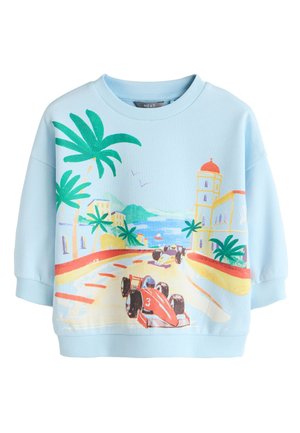 Hele sinine pusajakk ranniku teeraja võistlusstseeniga, kus on punased ja mustad võidusõiduautod, palmipuud, hooned ja taevas lendavad linnud.