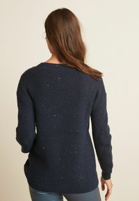 Next Sweter