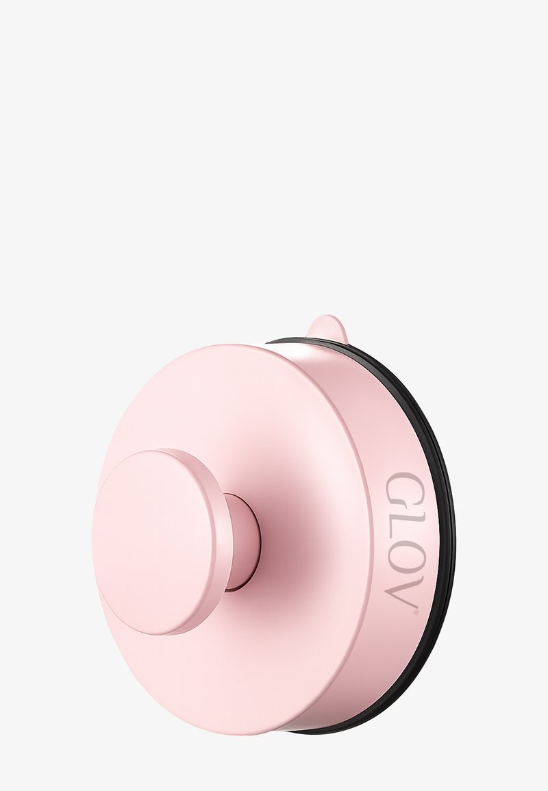 Rosa sugekopp med et glatt, rundt design. Har en sirkulær base, en sentral knott og en svart gummiring. Merkenavnet "GLOV" preget.