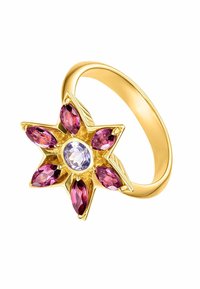 Anillo de oro con un engaste en forma de estrella que presenta una piedra central transparente y seis piedras preciosas en corte marquise de color rosa.