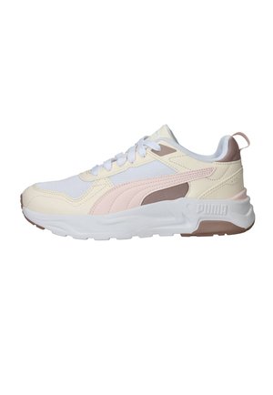White and beige Puma sneaker with pink and brown accents, white laces, and a thick white sole on a plain background.