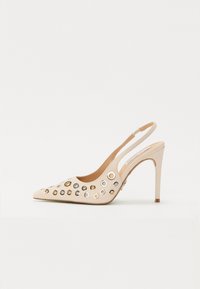 Beige, patent leather slingback heel with pointed toe. Features multiple circular grommets in gold and silver tones.  Stiletto heel design.
