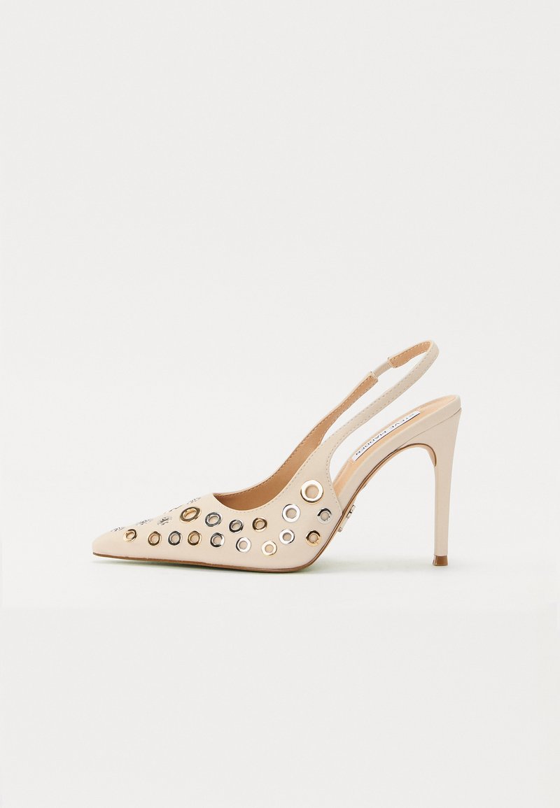 Beige, patent leather slingback heel with pointed toe. Features multiple circular grommets in gold and silver tones.  Stiletto heel design.