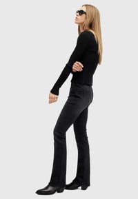 AllSaints HALDAN - Bootcut-farkut - black
