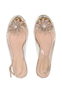 Gennemsigtige hæle sandaler med blomster rhinestone pynt, gyldne detaljer og beige indersål. Justerbar ankelrem for en sikker pasform.