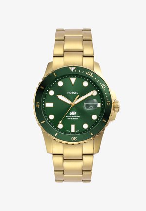 Orologio in acciaio inossidabile color oro con quadrante verde, indicatori delle ore bianchi, finestra per la data e lunetta girevole. Impermeabile fino a 100 metri.