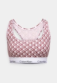 Sports bra featuring a red and cream geometric pattern, with a white band displaying the Calvin Klein logo, and a cross-back design.