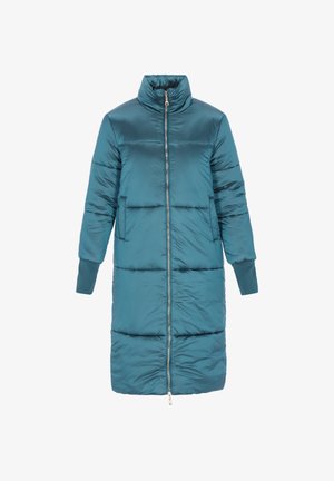 Petroolinvihreä toppatakki, jossa korkea kaulus, vetoketju edessä ja sivutaskut. Takissa on joustavat hihansuut ja hieman levenevä helma lisälämmön takaamiseksi.