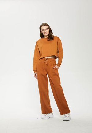 PASTEL - Tracksuit bottoms - almond