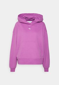 Purple hoodie made of soft fabric, featuring a large front pocket, a drawstring hood, and a small logo on the chest.