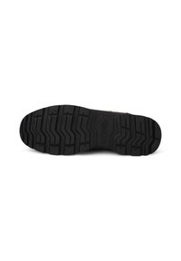 Sole in gomma nera con un motivo di trazione testurizzato, caratterizzato da scanalature e creste per la presa, con la scritta "WODEN" stampata sulla superficie.