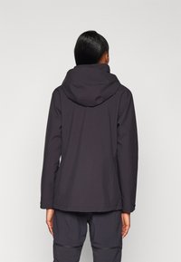 Black waterproof jacket with a hood, seamless design, and a matte finish. Features include long sleeves and a straight-cut hem.