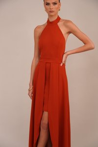 Red halter-neck dress with a fitted bodice, high slit, and flowing skirt. Made from smooth fabric with clean seams and no visible patterns.