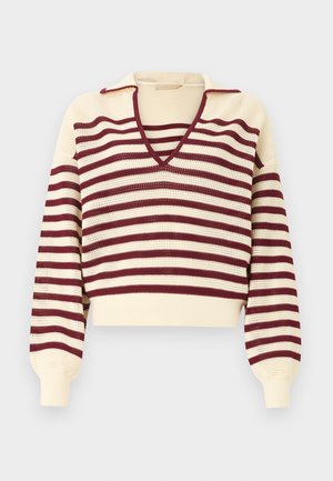 Cream knit sweater with burgundy horizontal stripes, deep V-neck collar, and long puffed sleeves with fitted cuffs.