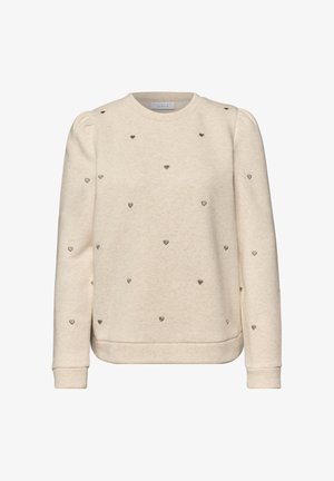 Kremowa bluza z długim rękawem z bufkami na ramionach, ozdobiona małymi haftowanymi wzorami serc rozmieszczonymi na tkaninie.