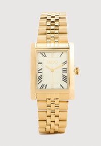 Χρυσό ορθογώνιο ρολόι χεριού με σχέδιο στη χρυσή μπρασελέ, λευκό καντράν, μαύρους ρωμαϊκούς αριθμούς και δύο διακοσμητικά κρύσταλλα. Μάρκα: LIU-JO.