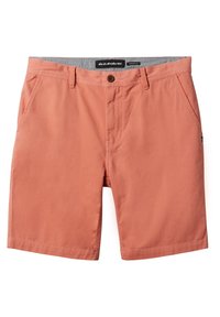 Shorts de couleur pêche en coton, avec fermeture à bouton, poches avant et coupe droite. Étiquette visible à la taille.