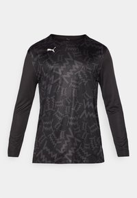 Long-sleeve athletic shirt in black with a textured zigzag pattern, featuring a round neckline and logo accent in white on the front.