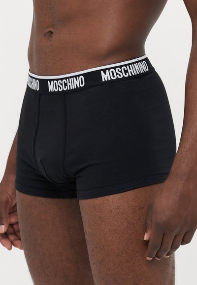Black cotton boxer briefs with a white Moschino logo on the elastic waistband, featuring a snug fit and a smooth texture.