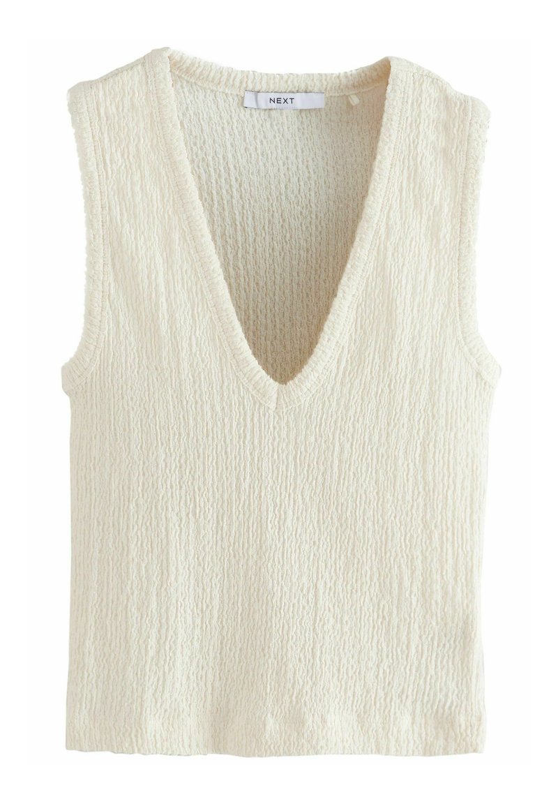 Cremefarbenes ärmelloses Oberteil mit tiefem V-Ausschnitt, strukturiertem Stoff und lockerer Passform. Die Ränder sind leicht ausgefranst für einen lässigen Look.