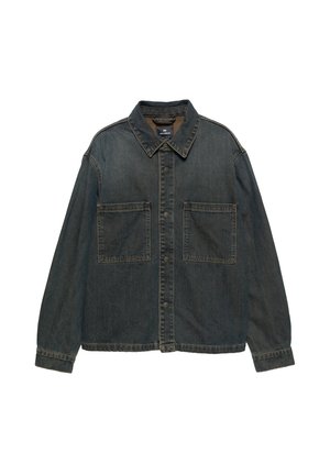 Denim jacket in dark blue, featuring a pointed collar, snap front, and two large chest pockets. Loose fit with prominent stitching detail.