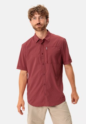 Kurzarm, bordeaux-rotes Karoshirt mit Knopfleiste, Brusttasche und Kragen. Besteht aus leichtem Stoff und hat eine lockere Passform.