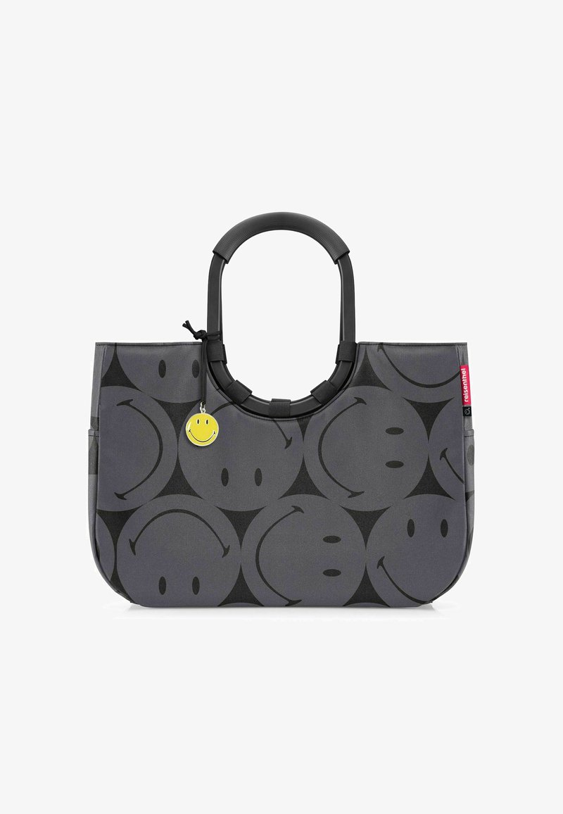 Borsa a tracolla grigia realizzata in materiale resistente, con un motivo di facce nere sorridenti, manico rotondo nero e un ciondolo giallo a forma di sorriso.