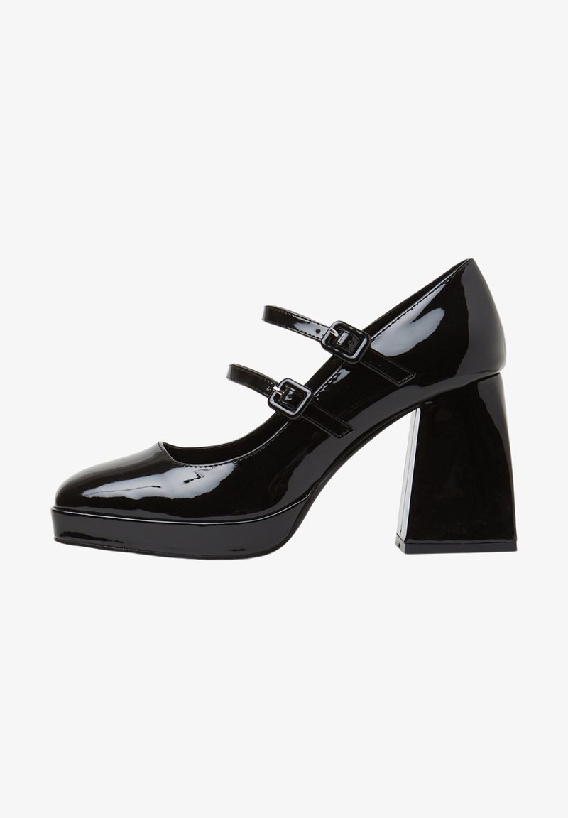 Chaussure Mary Jane en cuir verni noir avec deux brides à boucle, bout rond, semelle plateforme et talon bloc.