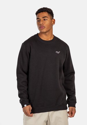 Black sweatshirt, cotton blend, crew neck, ribbed cuffs and hem, features small white logo on chest, relaxed fit, soft texture.