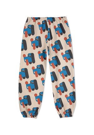 Cotton pants with an elastic waistband, featuring a beige background and a playful pattern of blue and black cartoon faces with red accents.